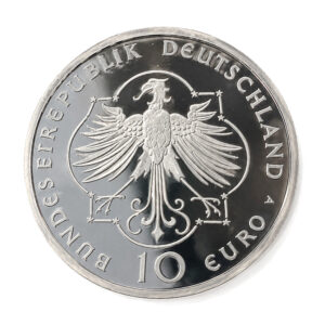 German 10-euro coin with the federal eagle and the inscription BUNDESREPUBLIK DEUTSCHLAND around the edge.