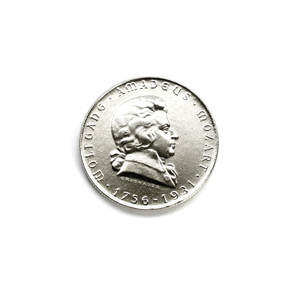 Coin with Mozart in profile and edge text AMADEUS MOZART 1756-1791.