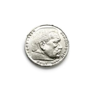 Close-up of a silver coin showing a man's profile facing right with engraved inscription around the edge.