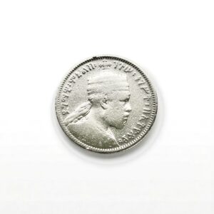 Silver coin with a right-facing bust and surrounding inscription in raised letters